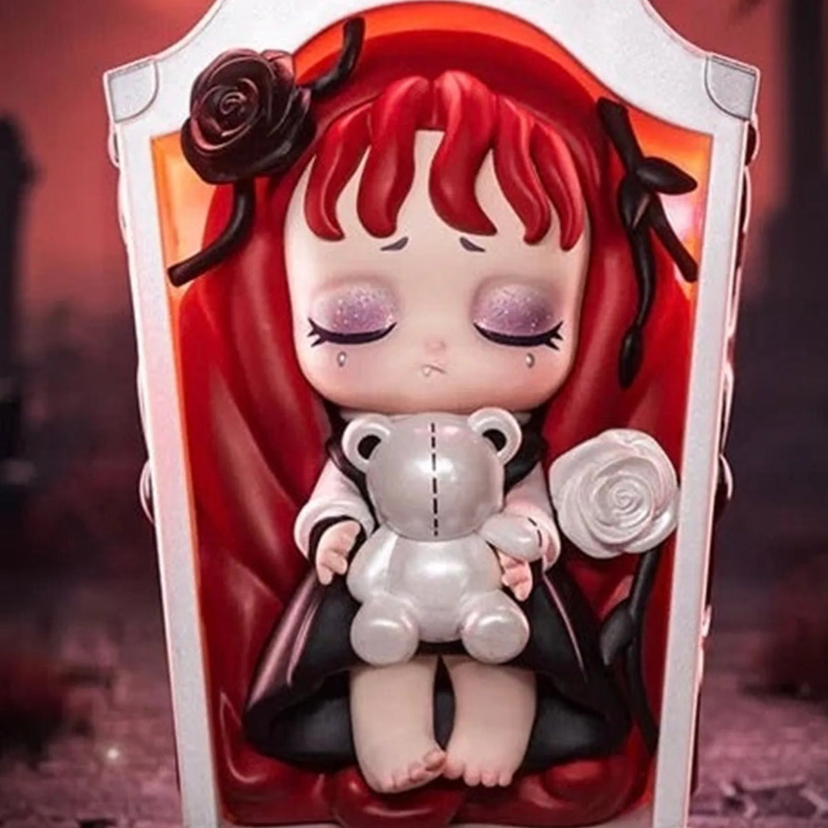 Lilith Secret Experiment red-haired figure in a casket-shaped design with bear and rose details; cropped series example