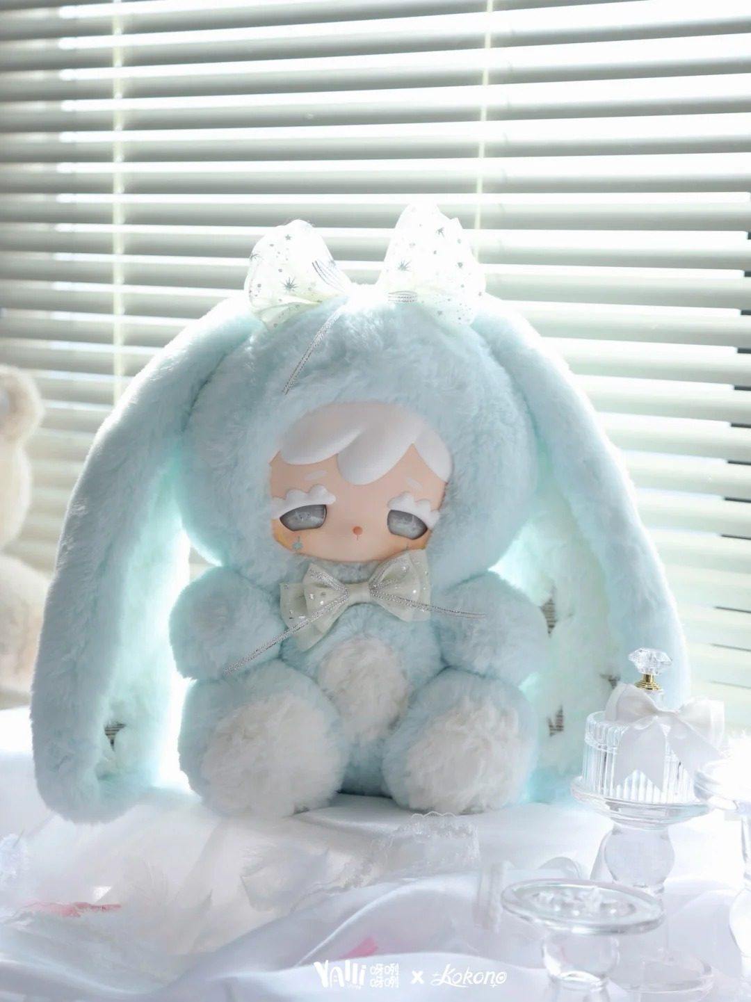 Kokono Lucky Star 600% complete blue plush doll beside display props; props not included, illustrative series design