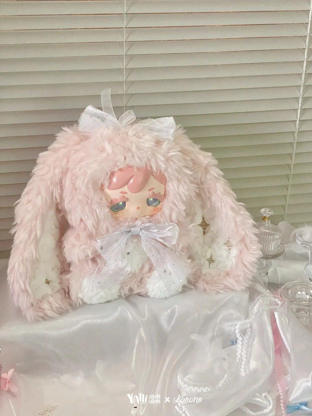 Kokono Lucky Star 600% pink plush doll in a window-side setting; illustrative series design