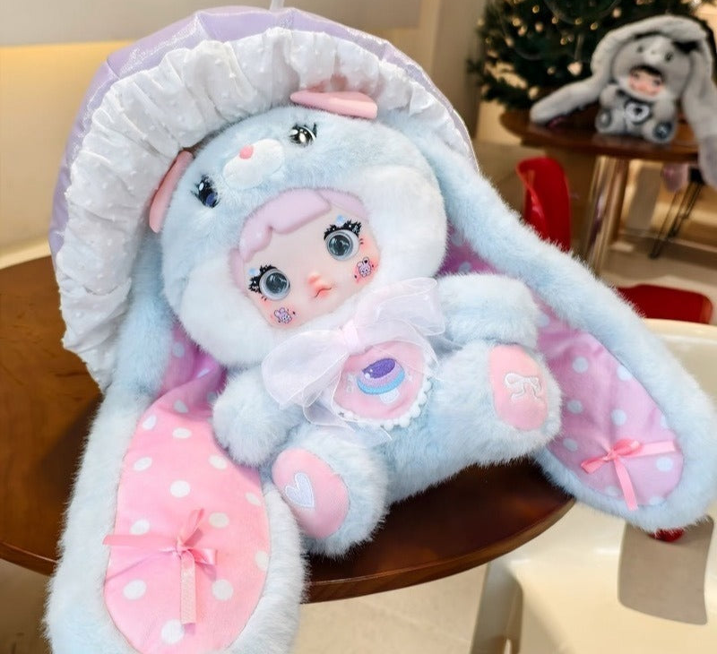 NOMMI Mushroom 400% pastel-blue and pink design front detail; close-up, not a complete product view