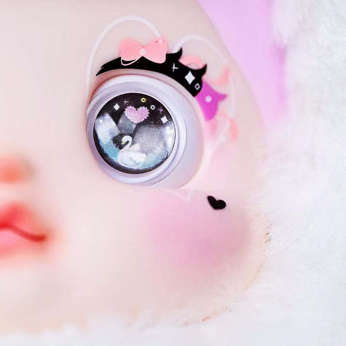 NOMMI Swan Lake glossy eye, lash, cheek and plush trim close-up