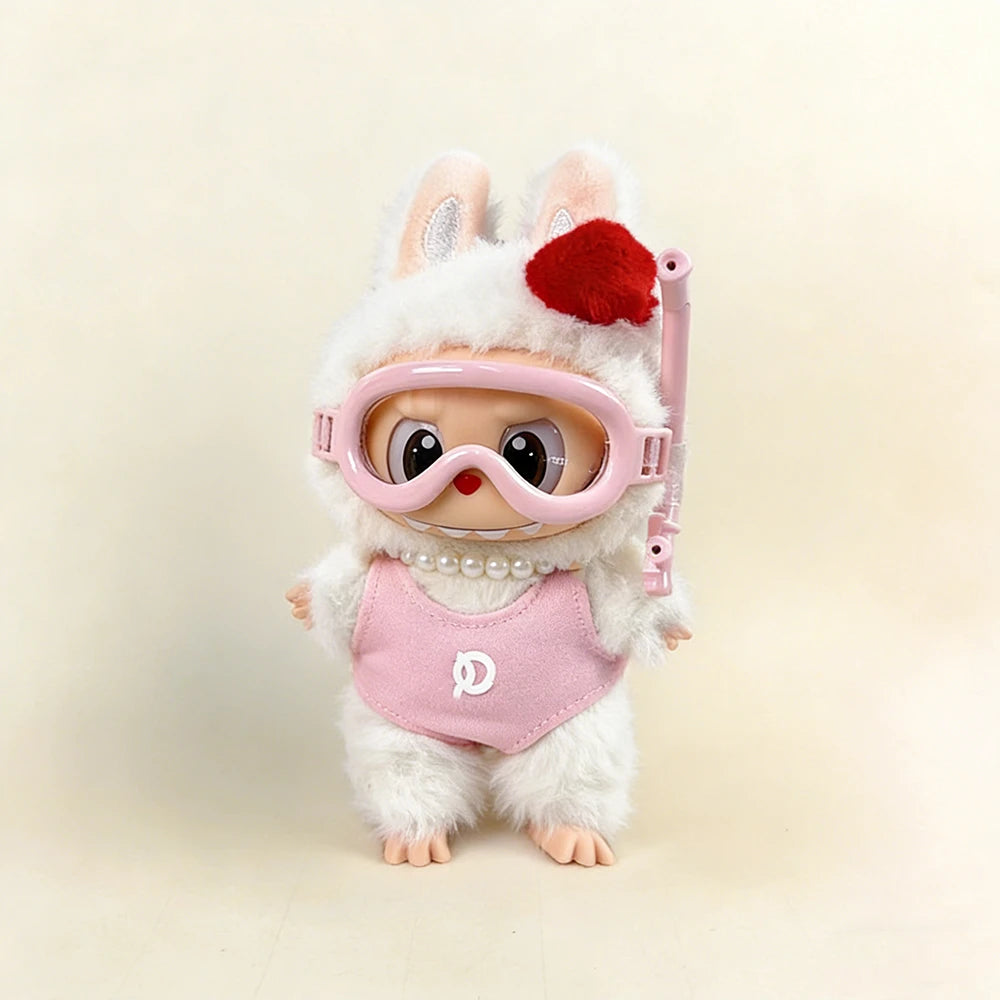 Toy figure with bunny ears, goggles, and a pink outfi