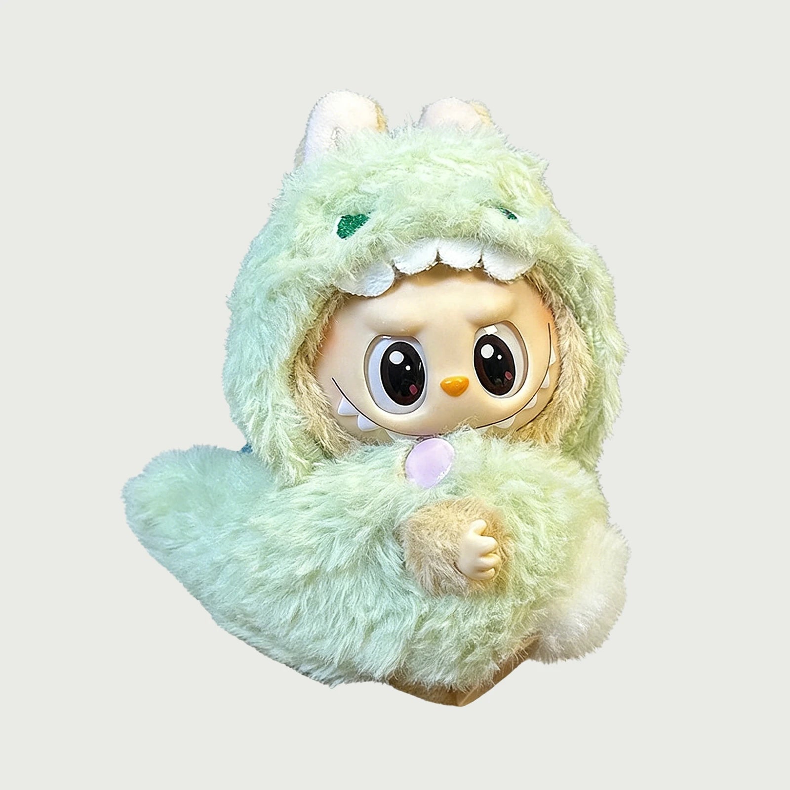 Labubu 17cm vinyl plush doll wearing a fluffy forest green monster hood and matching plush body suit.