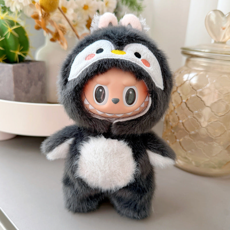 Labubu 17cm penguin plush onesie - lifestyle photo on desk with plants
