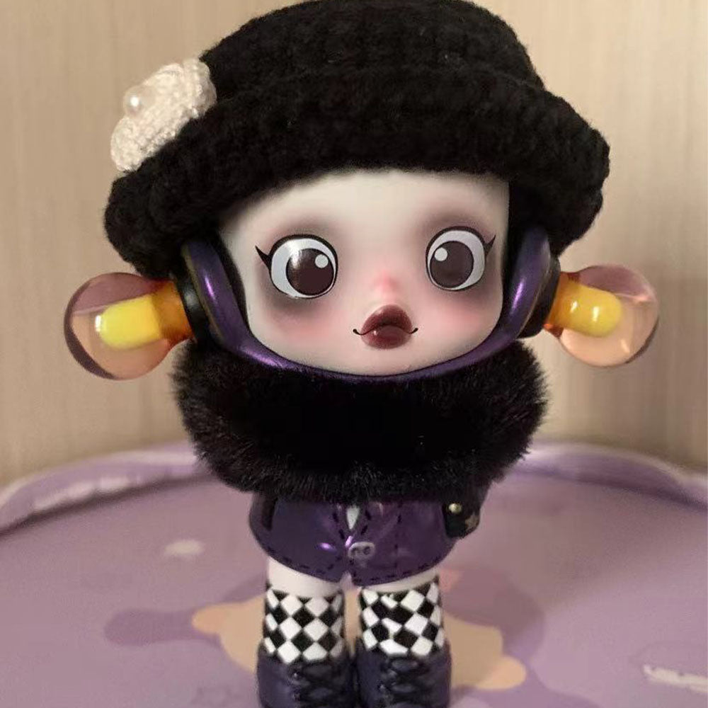 Skullpanda x The Addams Family series blind box figures including Wednesday, Morticia, and Uncle Fester.