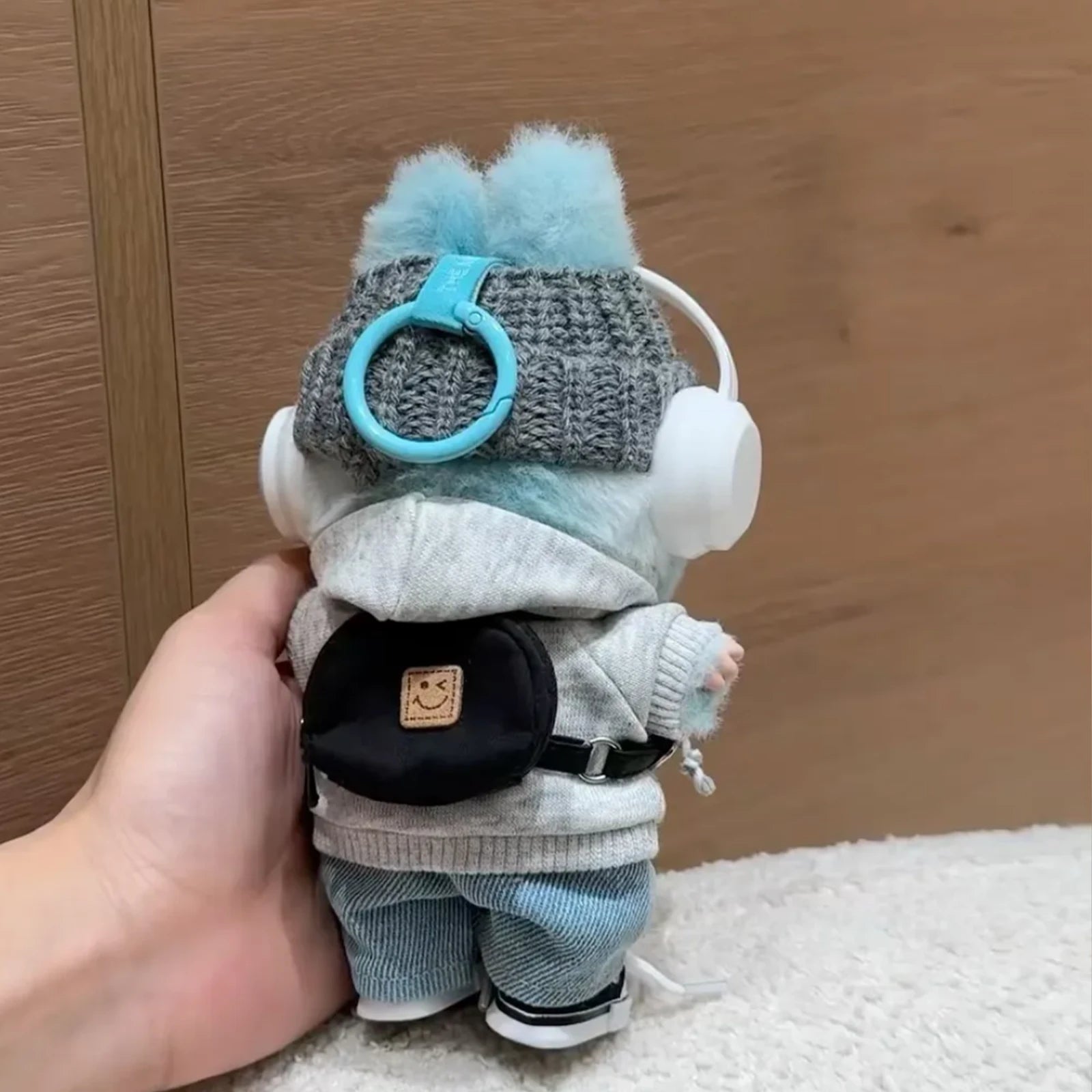 6-piece street style outfit for Labubu 17cm doll including a grey hoodie, blue corduroy pants, white headphones, and a black backpack.