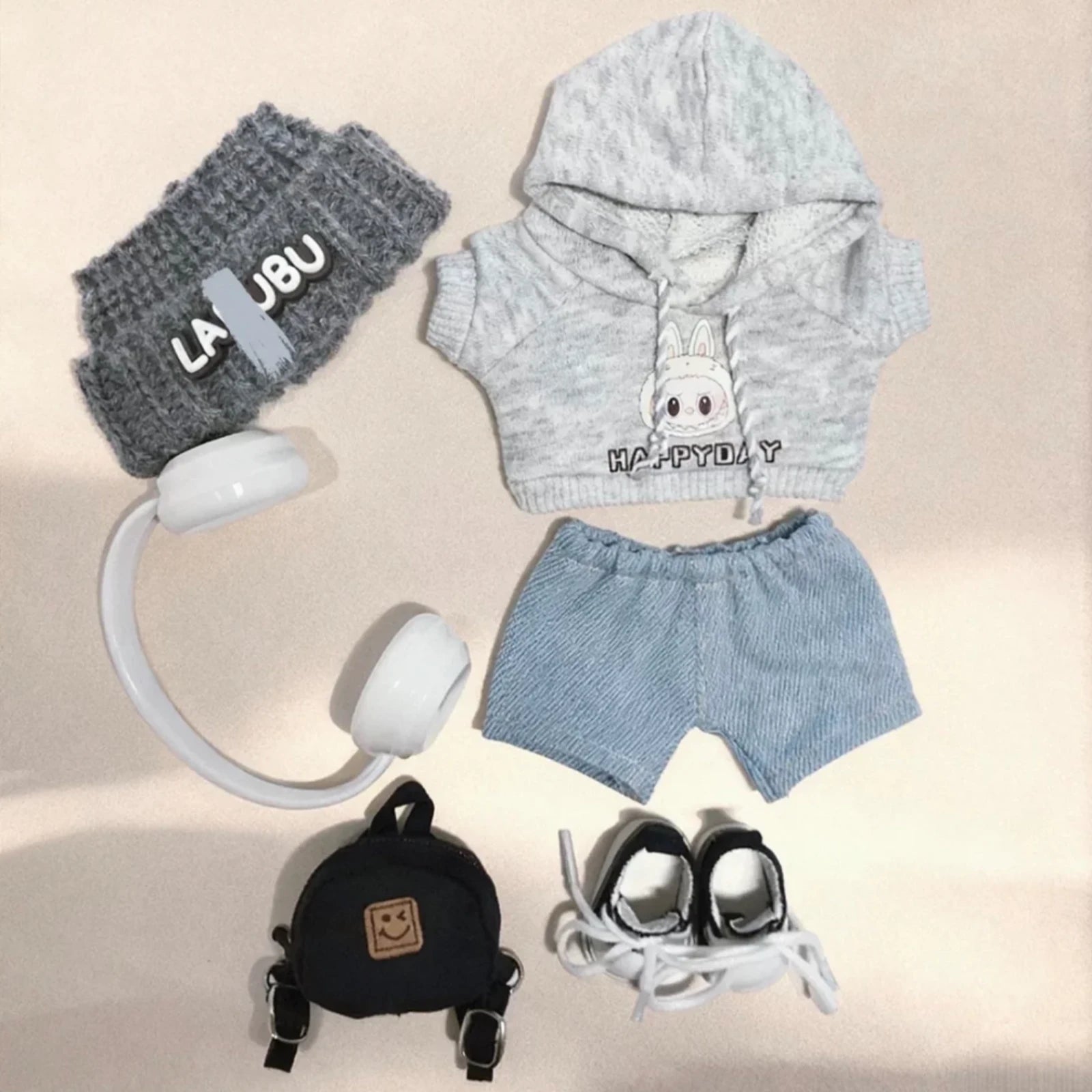 5-piece street style outfit for Labubu 17cm doll including a grey hoodie, blue corduroy pants, white headphones, and a black backpack.