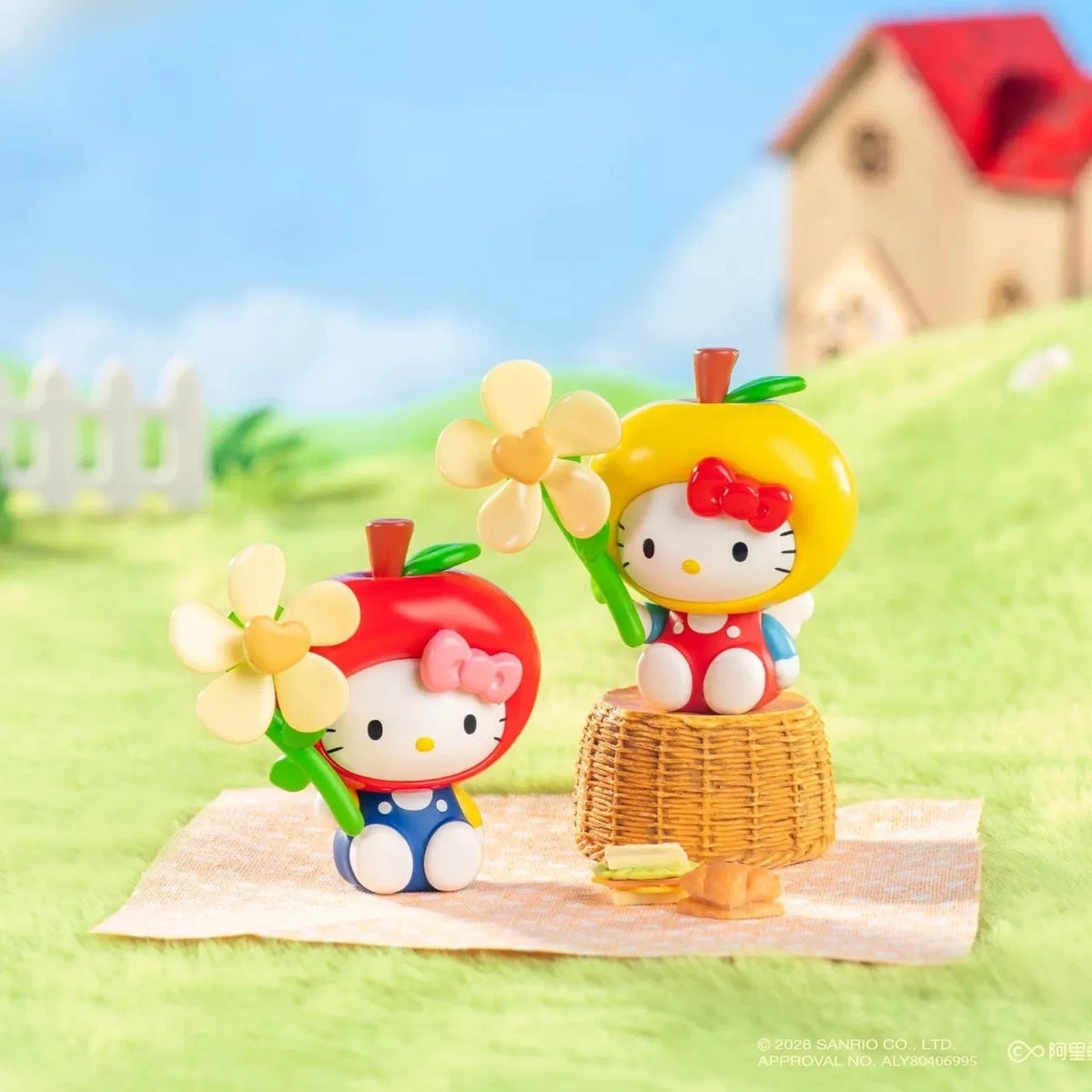 Two fruit-costume Hello Kitty figure design examples in an outdoor-style scene; designs shown are illustrative