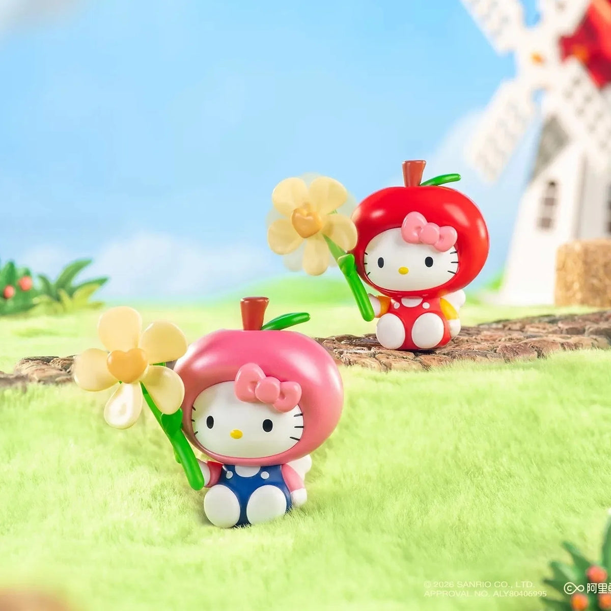Green and pink fruit-costume Hello Kitty design examples with flower-shaped details; scenic props are not promised as included