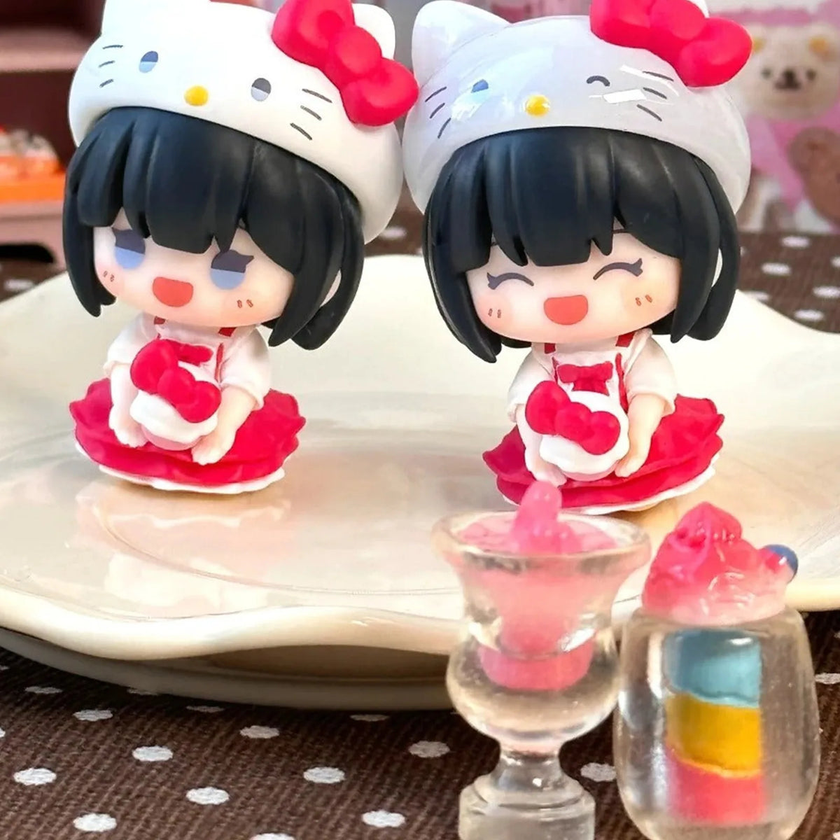 Link Click Sweet Moments red-outfit mini figures with character hoods; series examples