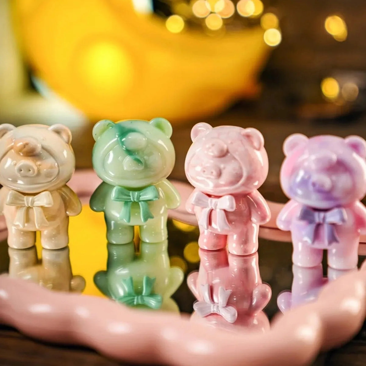 LuLu The PIGGY Teddy MINI bear-costume figures in pale colors, shown as series design examples rather than a three-bag assortment.