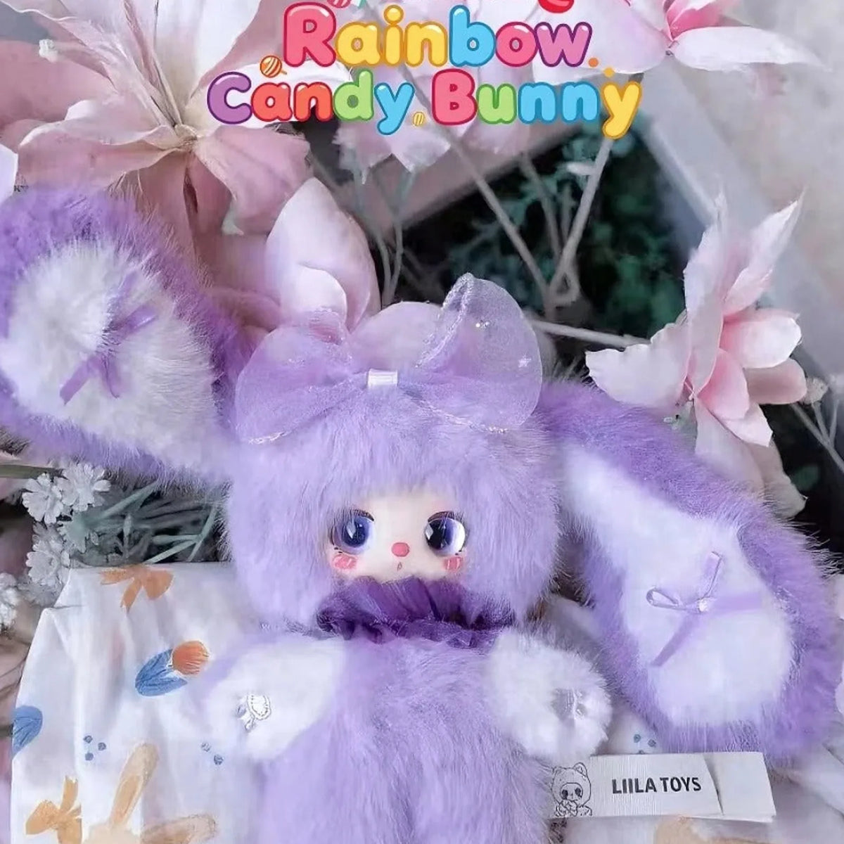 Purple Rainbow Candy Bunny plush among flowers | KikiBuddies