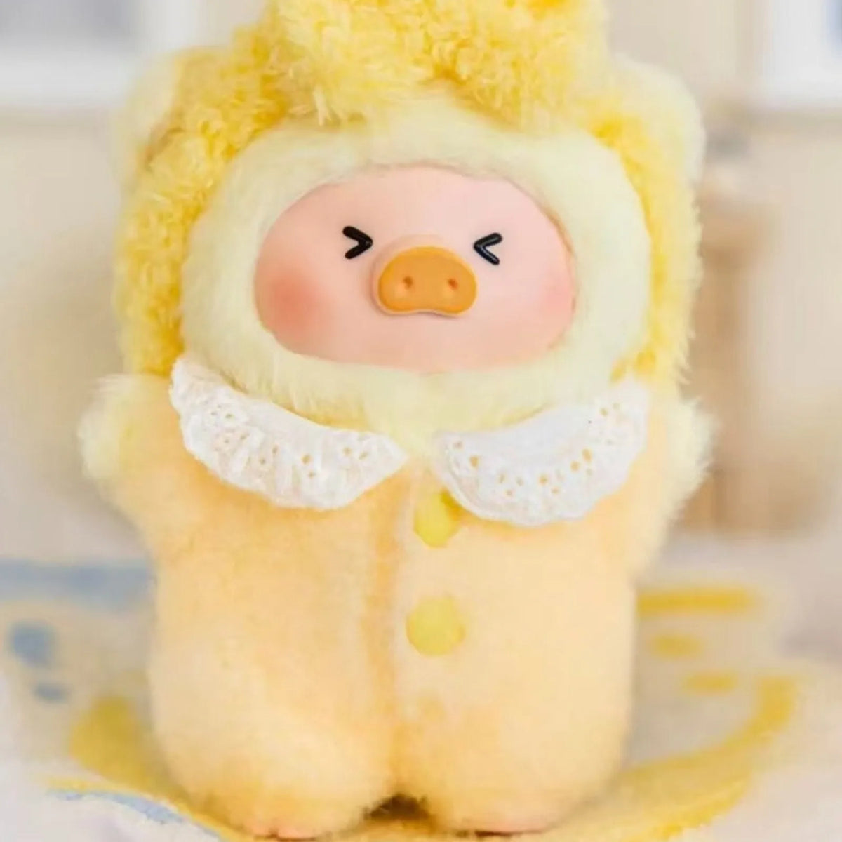 LuLu the Piggy Dreaming Wonderland yellow plush design, face and clothing detail crop
