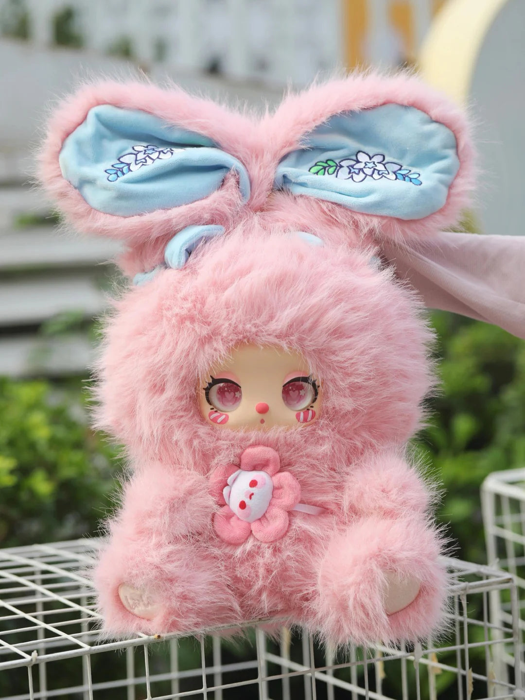 Complete pink Liila plush design example with full upright floral-lined ears, face, flower chest detail, body and both paws; original source photograph; random design not guaranteed; random purchases do not guarantee this design