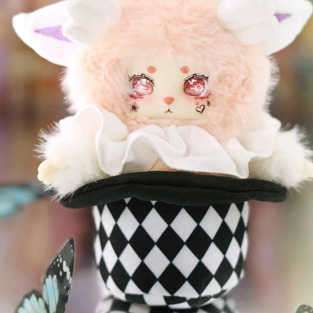 Pale LOKIKI plush in a black-and-white costume; series design example | KikiBuddies