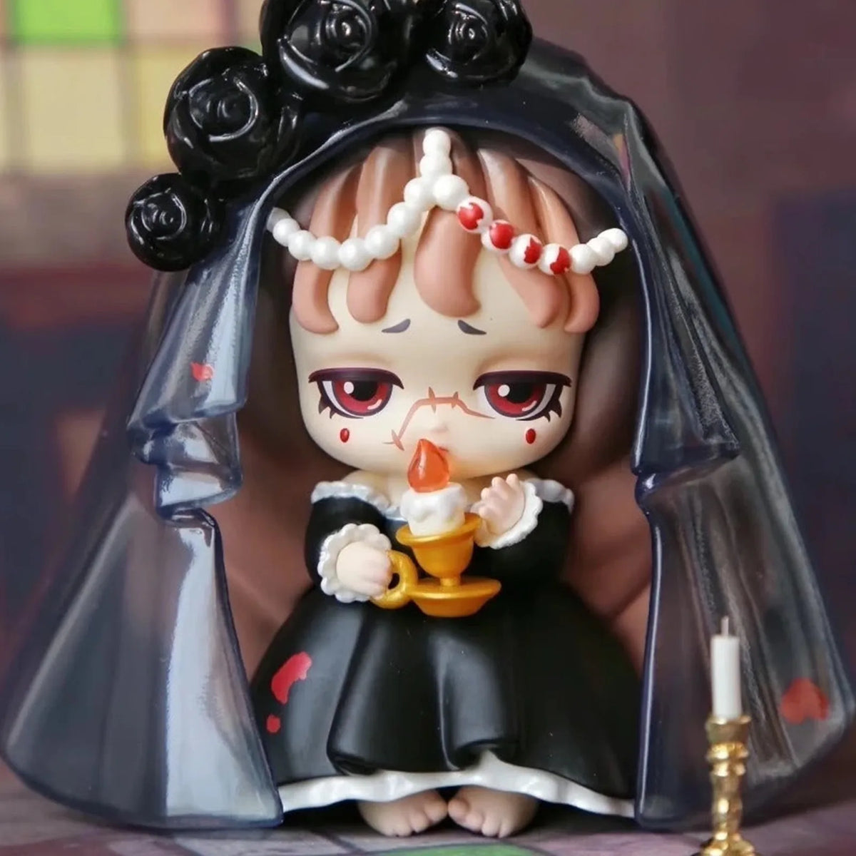 Lilith figure in a black veil with candle detail; series design example | KikiBuddies