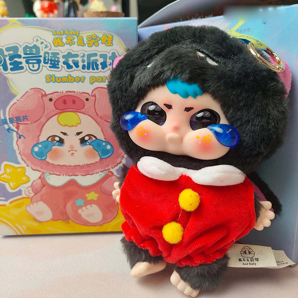 Complete Sad Baby plush pendant design example with hood, face, front body, feet, tag and metal ring; random purchases do not guarantee this design
