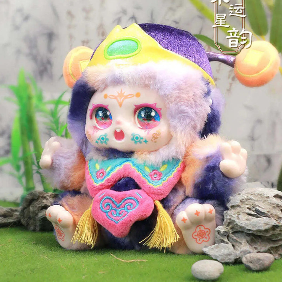 KIMMON plush in a purple and yellow costume; series design example | KikiBuddies