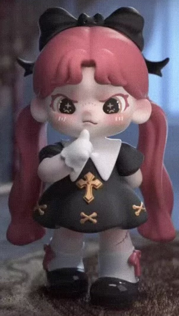 Complete red-haired Dora figure example with full black bow, side headwear, braids, face, black dress, legs and both shoes; random purchases do not guarantee this design