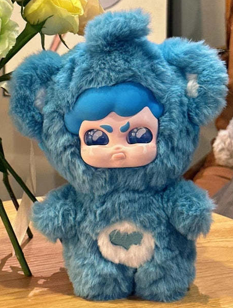 Complete blue MUMU Forest Whisper plush example with full top tuft, ears, face, body, hands, belly tree patch and both feet; random purchases do not guarantee this design