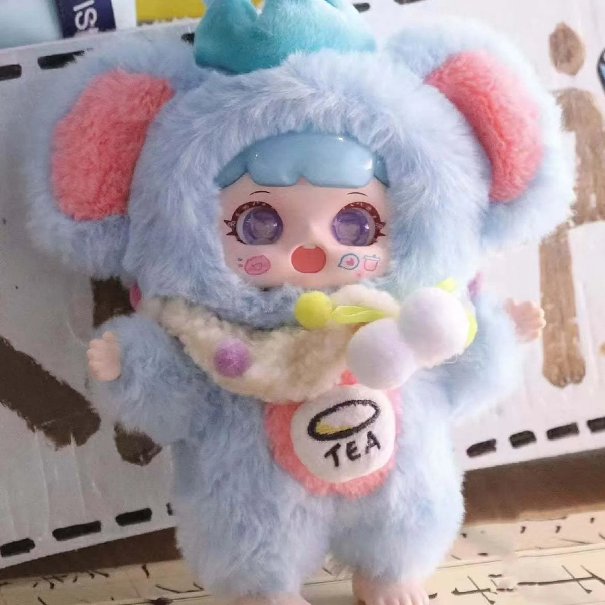 MANCHAO A Mouthful of Sweet blue plush costume, crown-shaped head detail and tea-cup front detail; series example