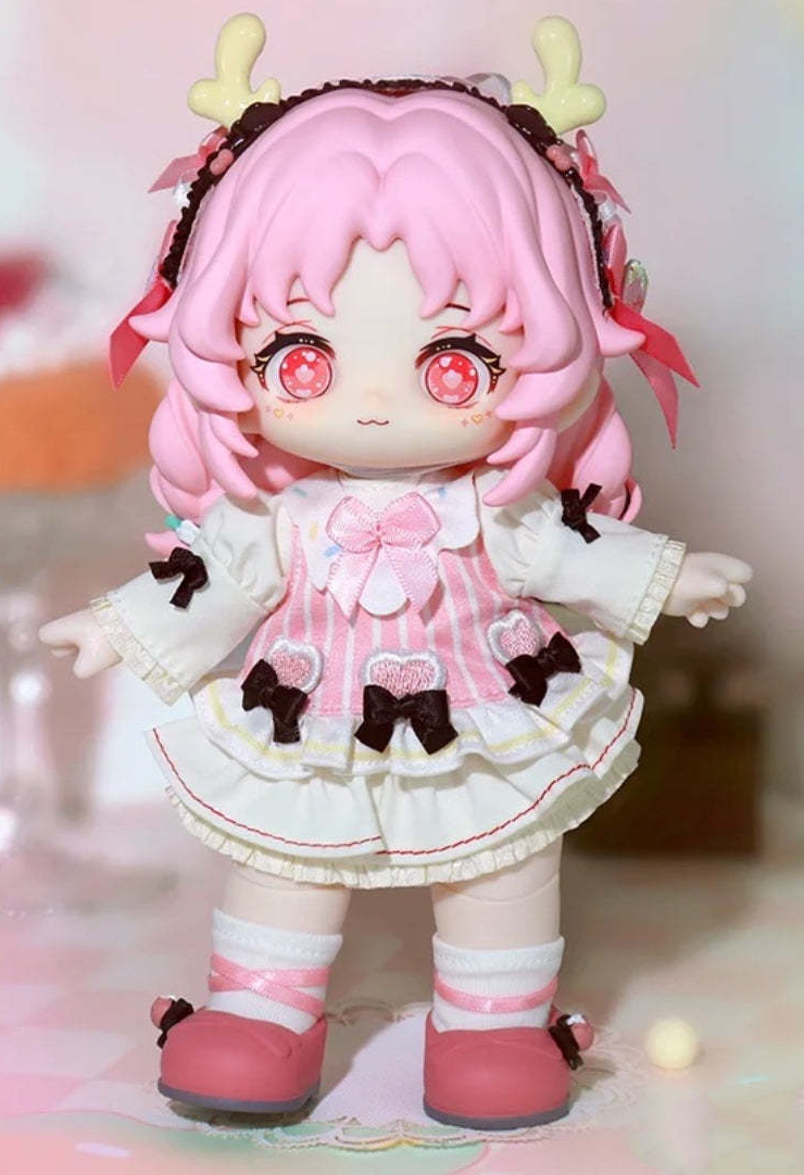Complete pink-haired HANI figure example with antler headband, face, dress, hands and both shoes; random purchases do not guarantee this design