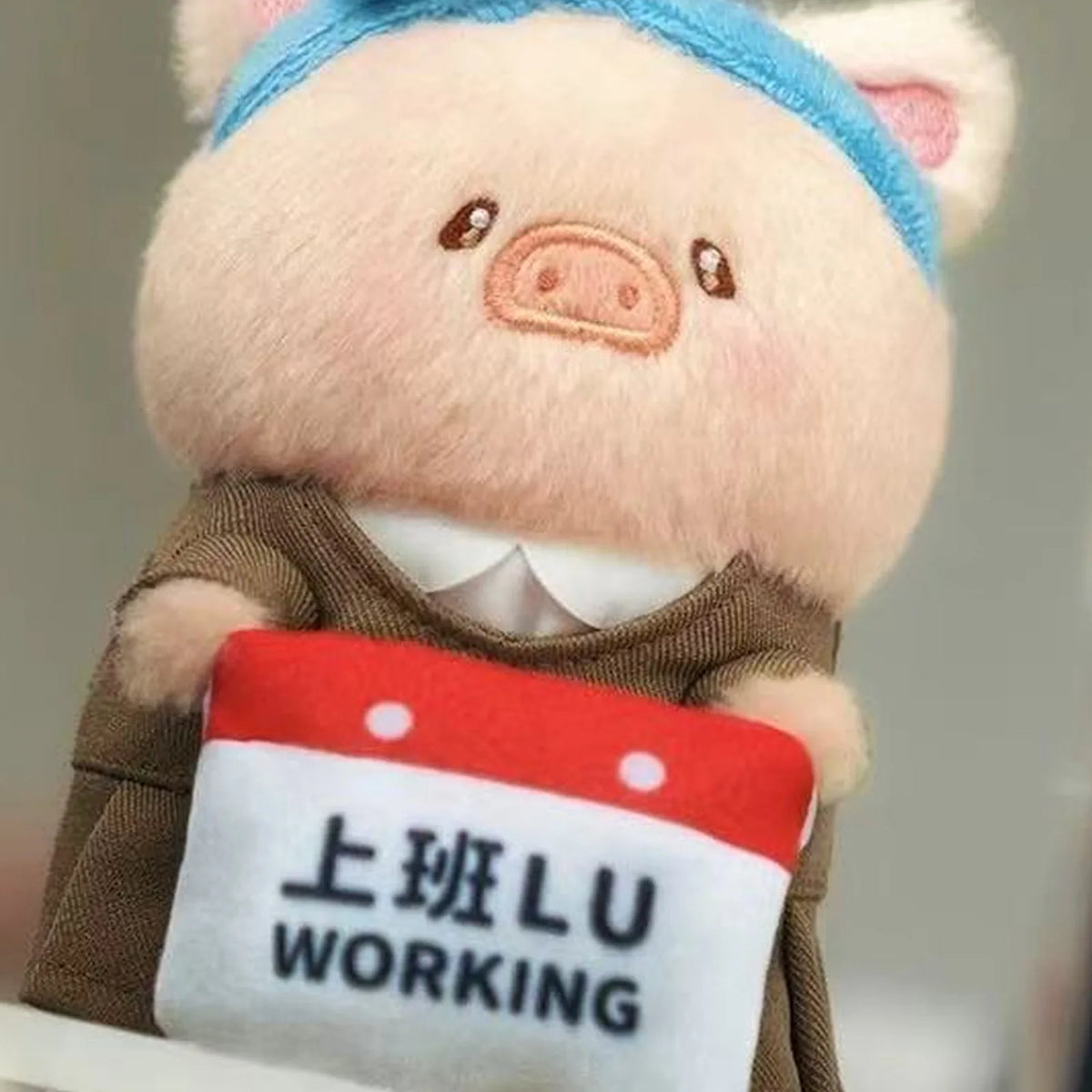 LuLu My Workplace Partners blue-headband plush with WORKING placard; example design