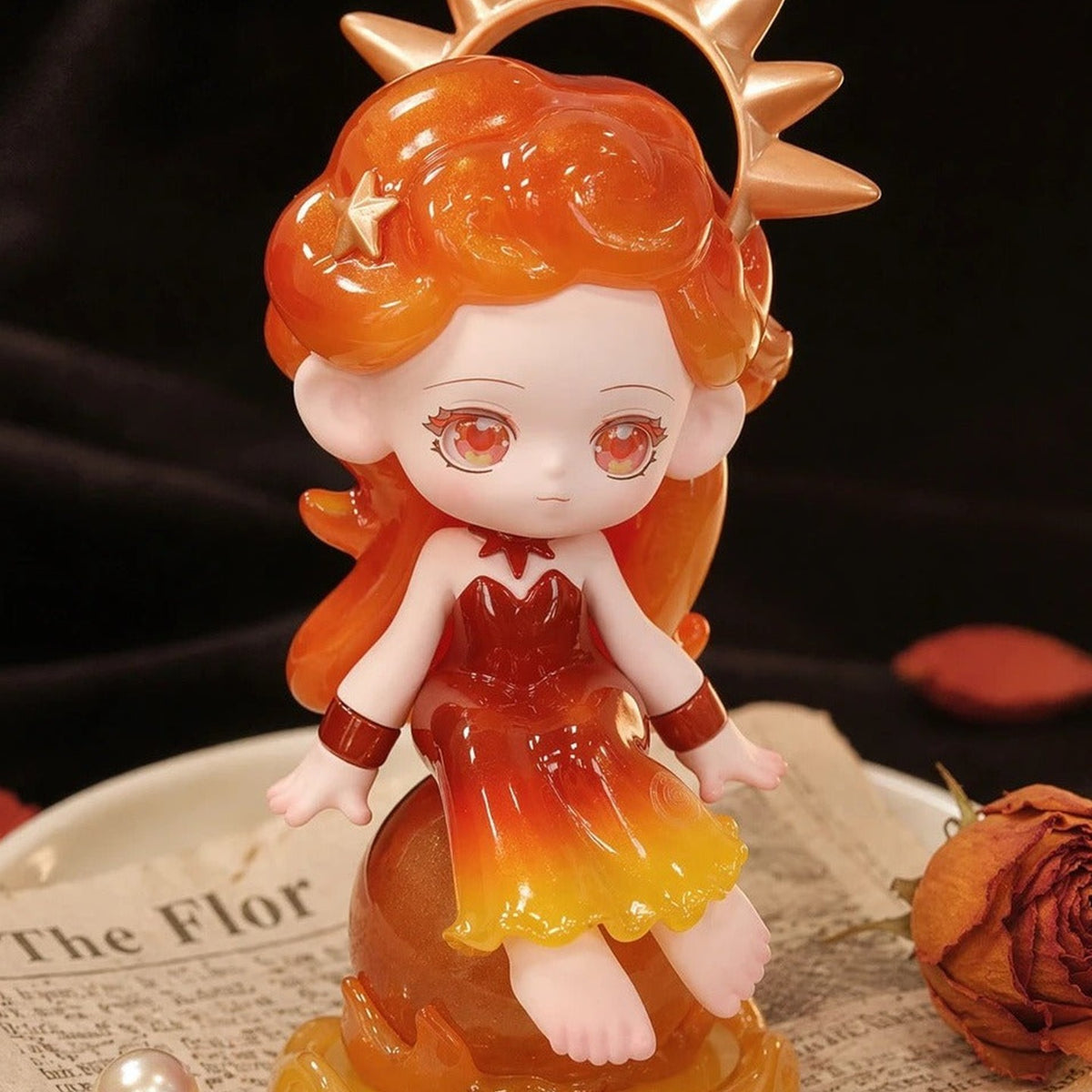 Orange-haired Lukiss character with a sun-inspired headpiece and warm-colored outfit; physical series reference, random purchase does not guarantee this character
