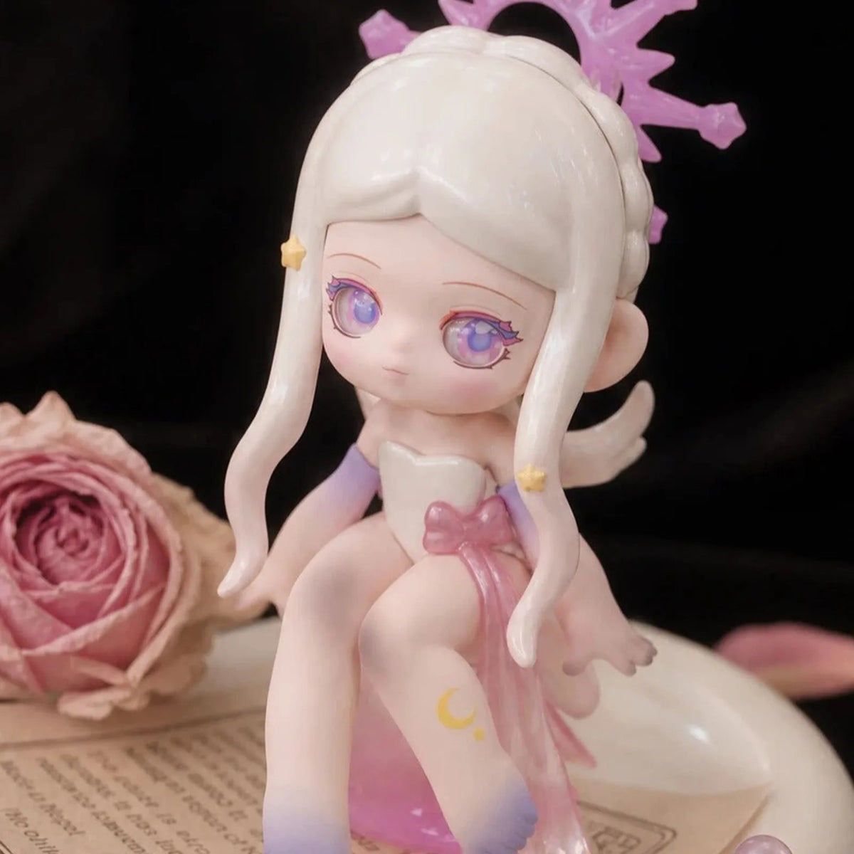 White-haired Lukiss character with a purple crown and pink crescent outfit; physical series reference, random purchase does not guarantee this character