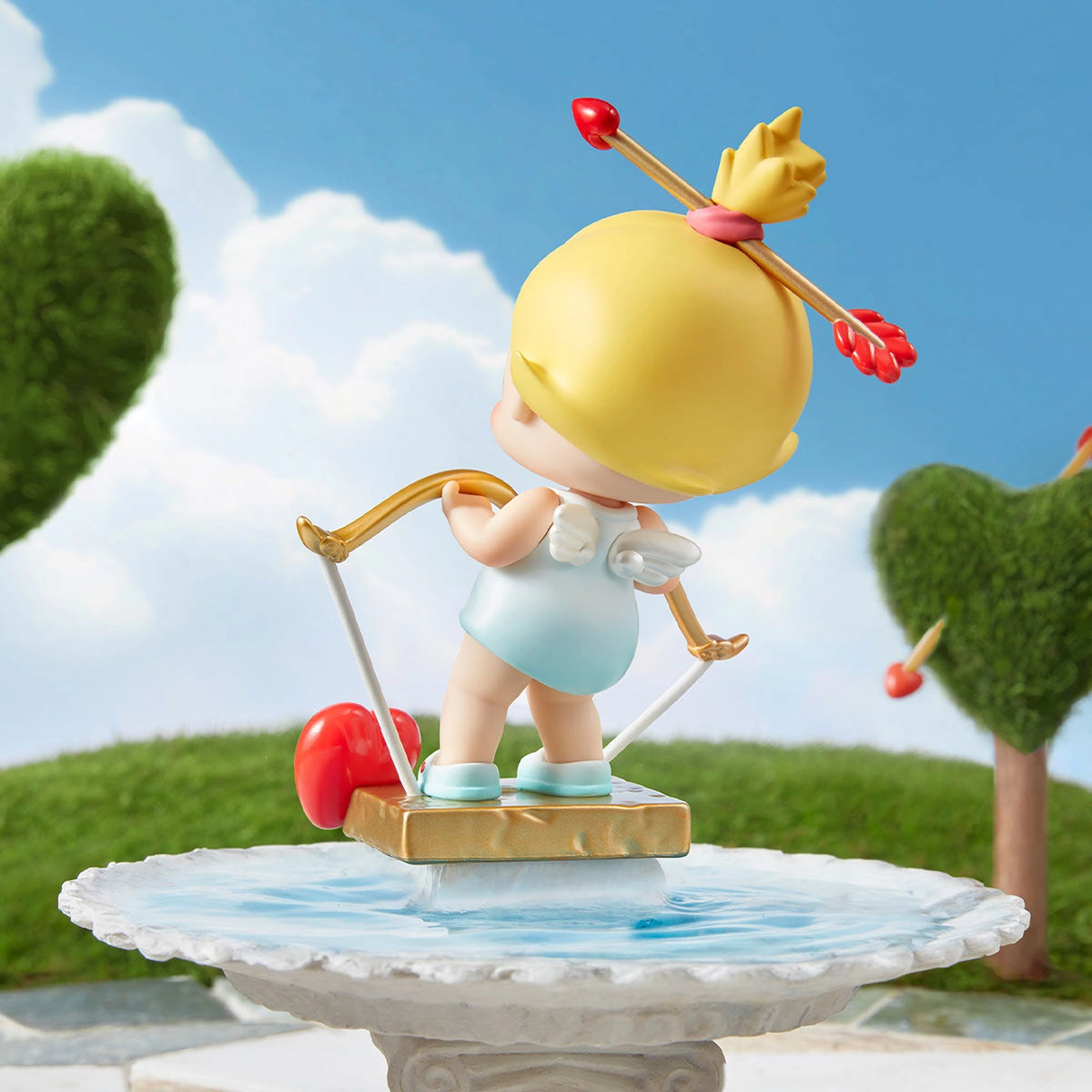 Baby Molly Little God of Love figure, back view in original scene; scene props excluded