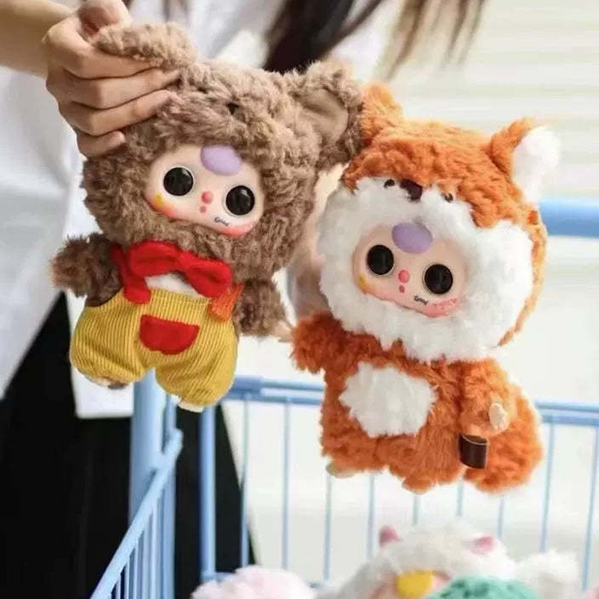 Baby Three V3 brown and orange plush examples; no specific random-box design guaranteed