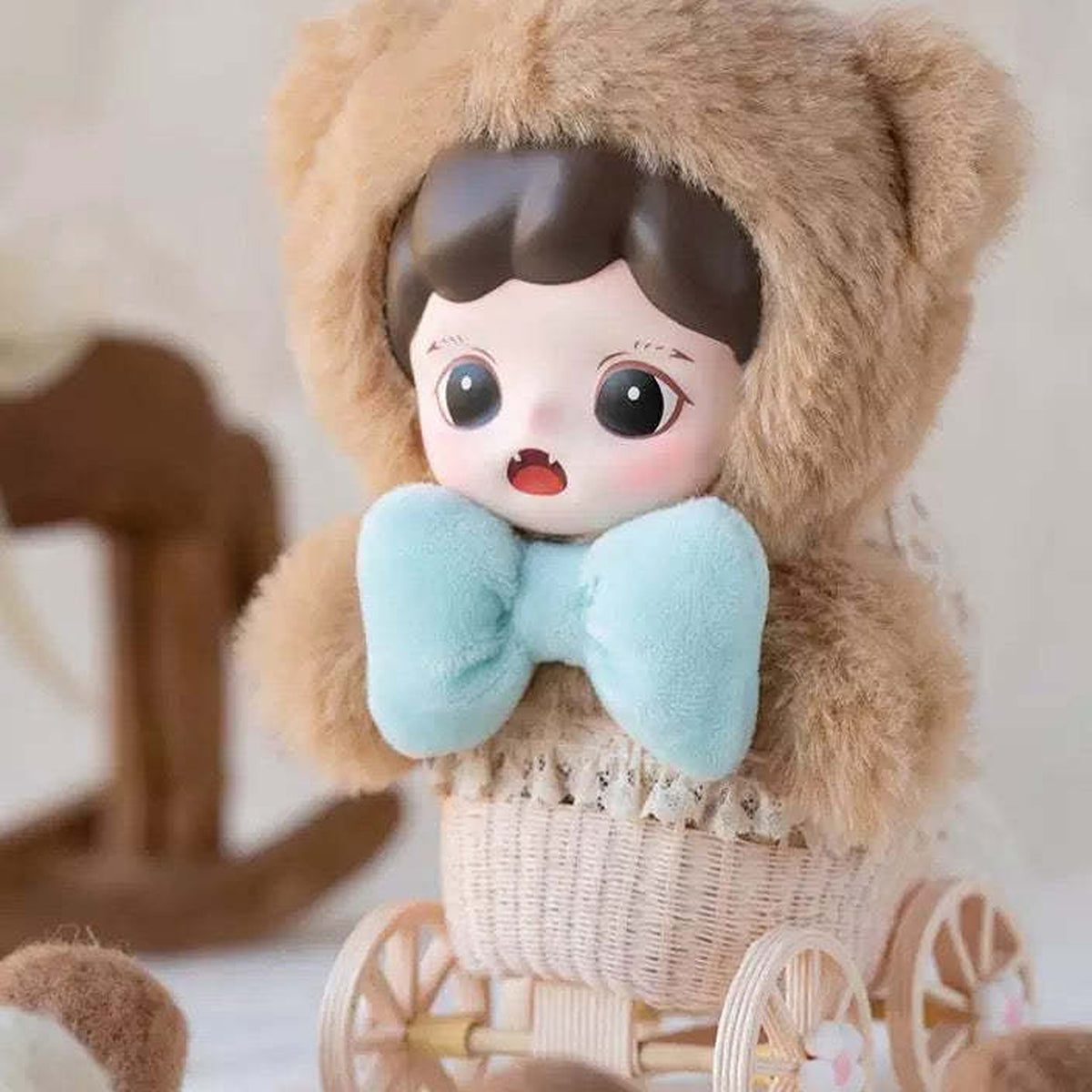 Baby Zoraa Fluffy Cabin: Brown Fluffy Cabin plush design with a blue bow; props not included
