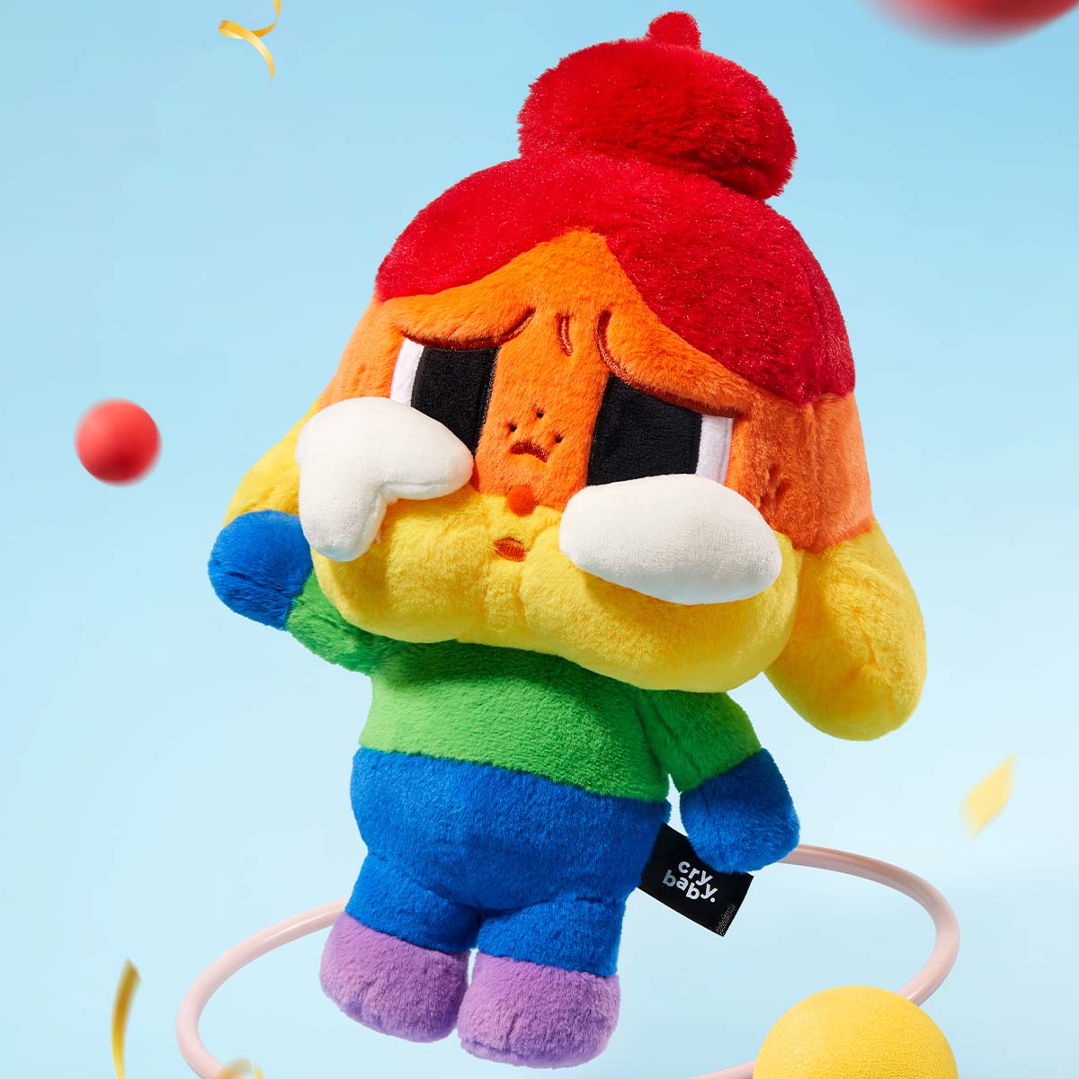 CRYBABY Cheer Up Baby rainbow plush doll styled appearance; props excluded