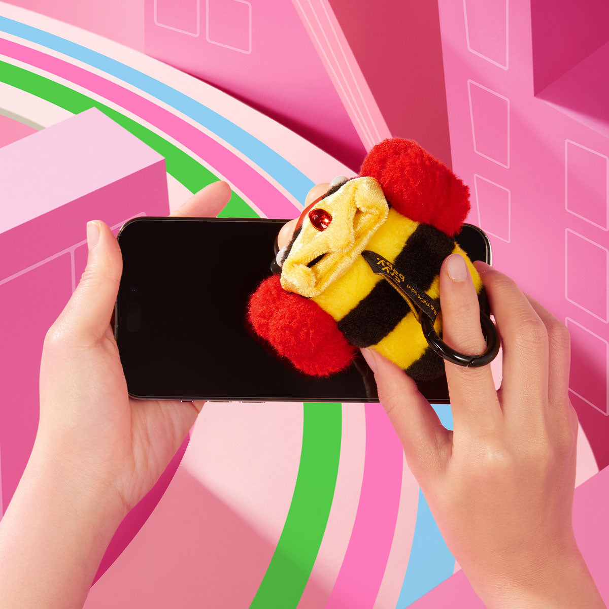 Morbucks vinyl face plush pendant back and ring in a phone display scene; phone not included, compatibility not guaranteed