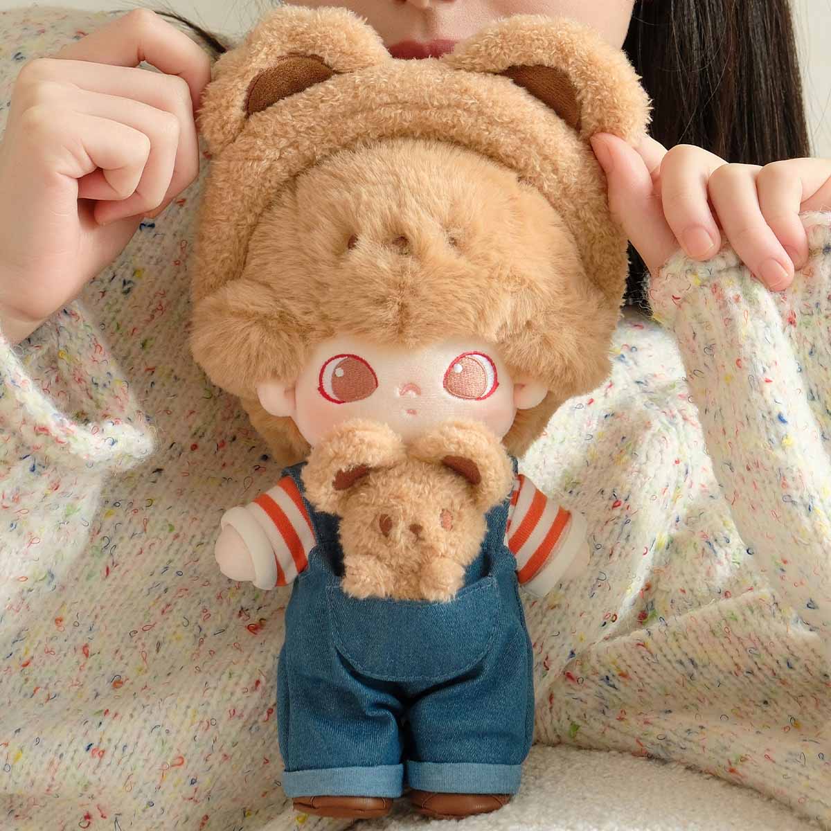 DIMOO Animal Kingdom cotton doll held for scale; exact dimensions are not stated