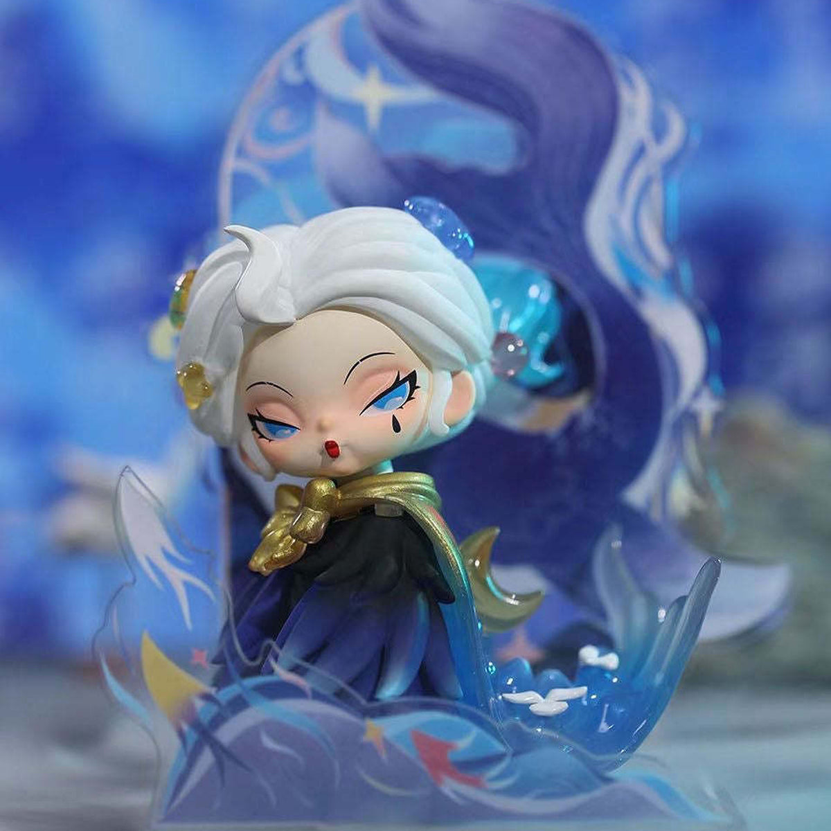 DODO NAMI Floating Mountains and Seas, Blind Box - Figure detail with blue flowing decoration cropped; random design not guaranteed