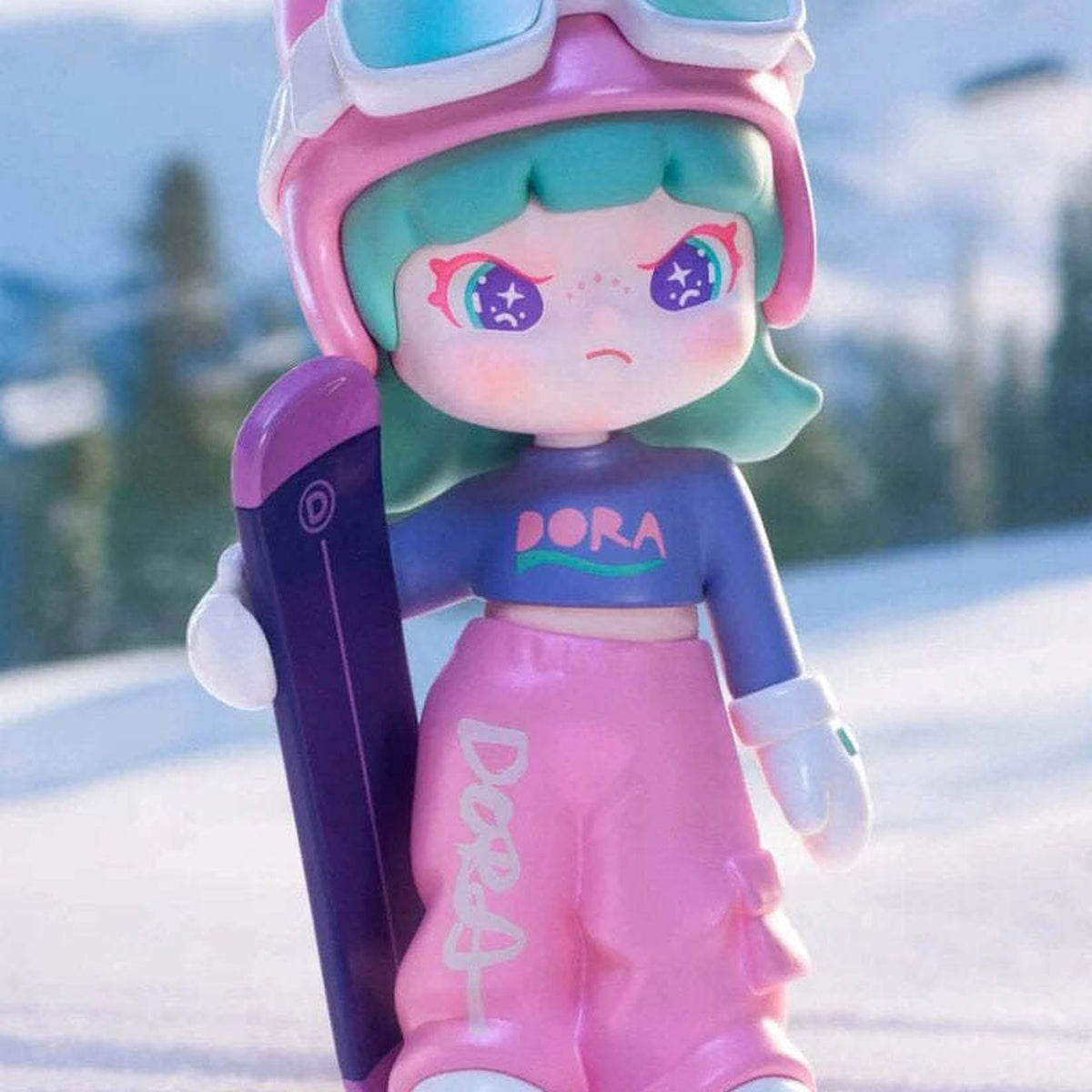 Dora Escape Plan Series Figures, Blind Box - Dora snowboarding design detail; upper helmet and lower shoe edges cropped; example design, not guaranteed in random boxes