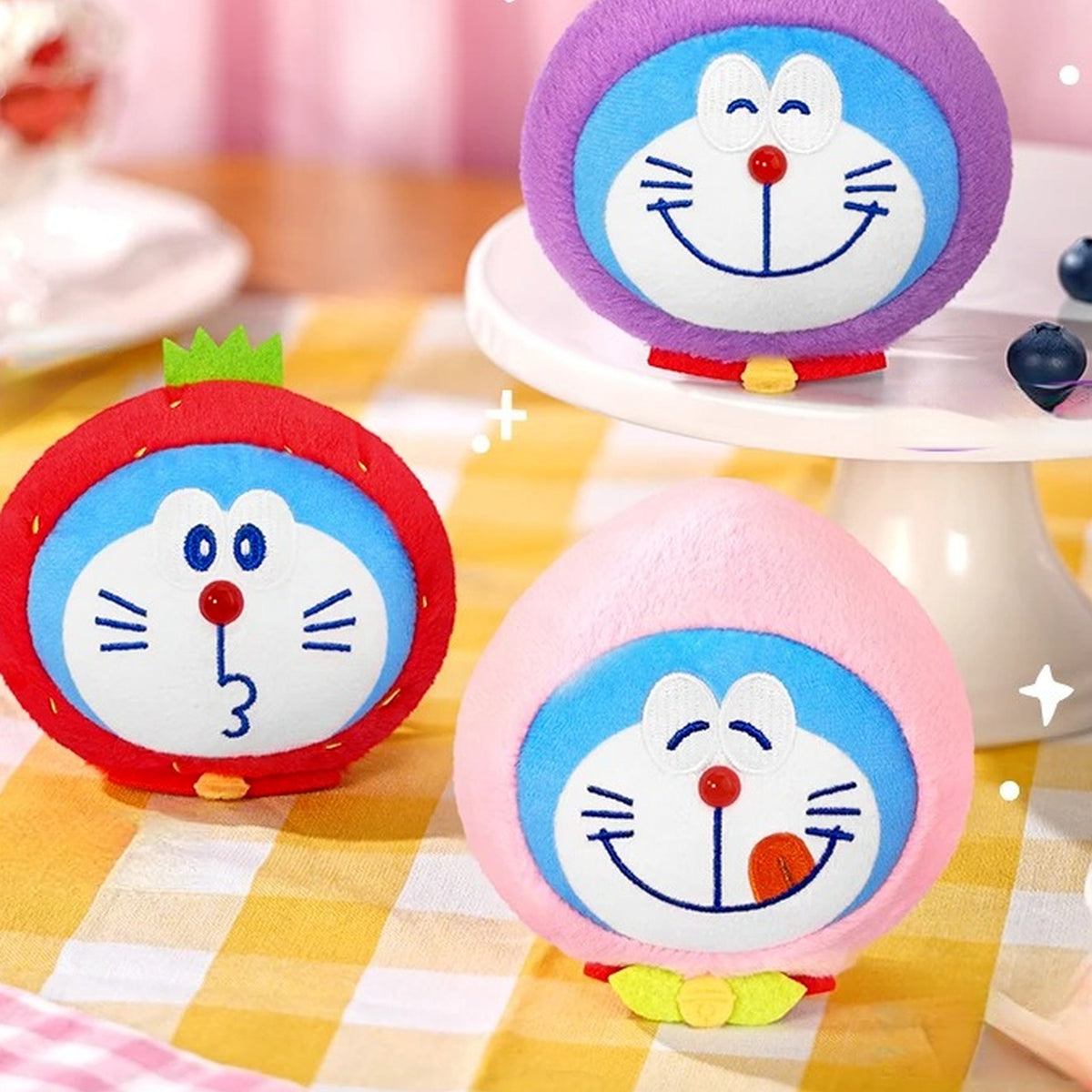 Doraemon Lucky Fruit V1 Series Plush Pendant Blind Box - Three fruit plush pendant designs with upper purple example cropped; display props not included; random design not guaranteed