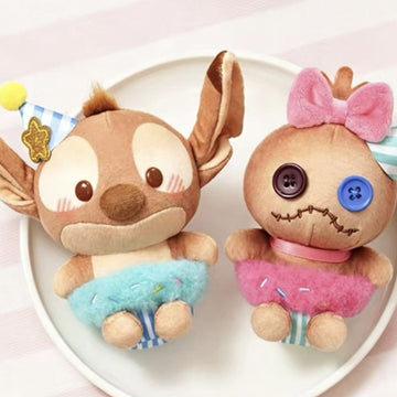 DSN Cocoa Workshop Series Plush Pendant - Complete pink button-face plush pendant example; adjacent blue example cropped; random design not guaranteed