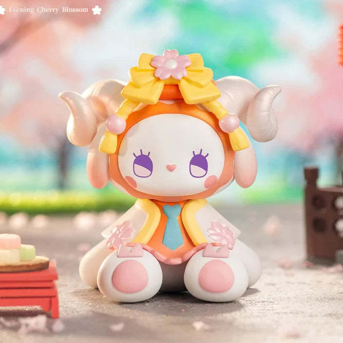 EMMA Secret Forest Cherry Blossom Series Blind Box - Complete yellow-outfit seated figure example; random design not guaranteed