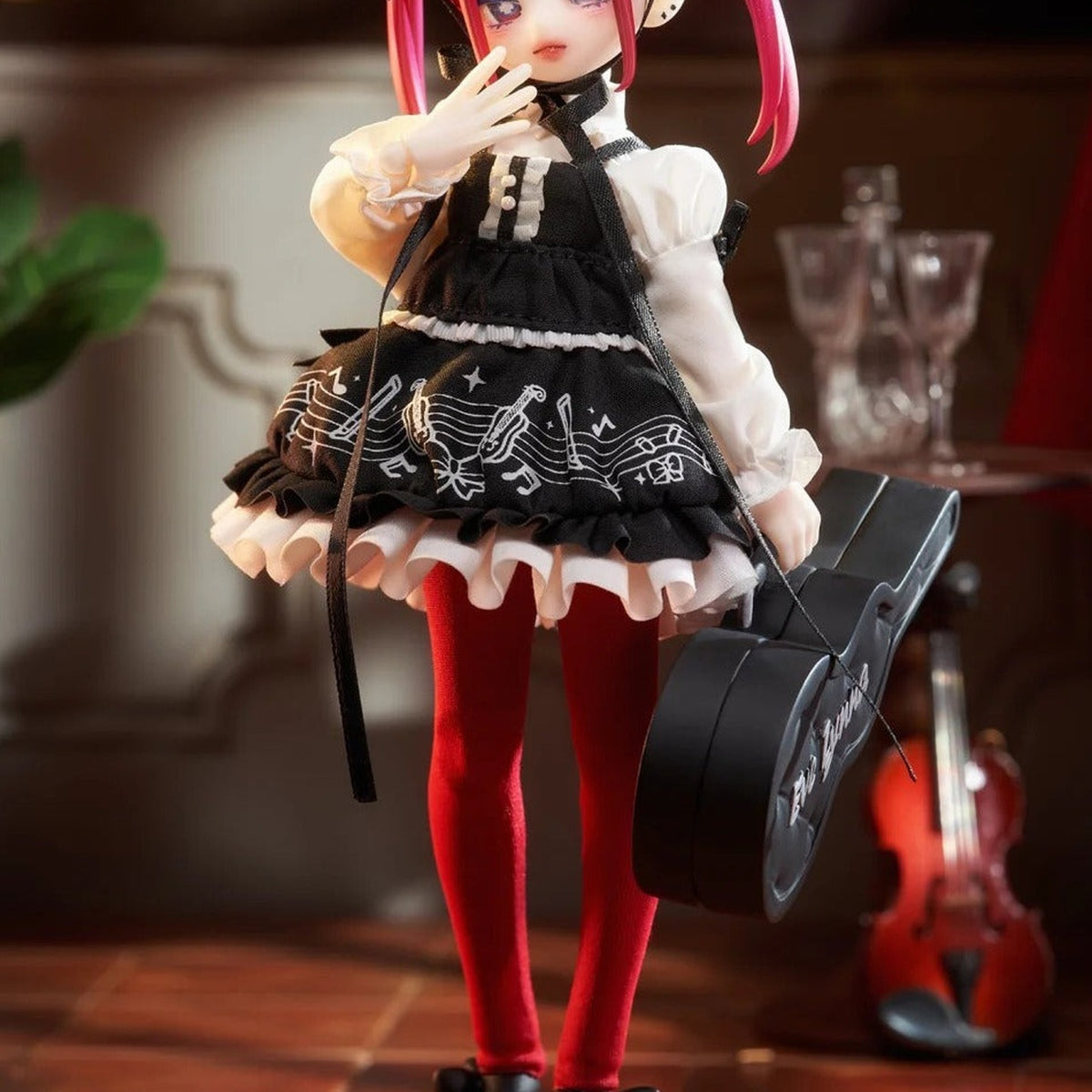 Eve Lynna RHYTHM black-and-white dress, red stockings and accessory-case detail; series example