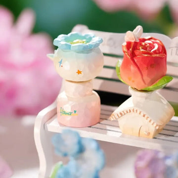 Floral Whispers Series Spin Figure Blind Box - Complete blue flower-shaped spin figure example beside rose example; random design not guaranteed