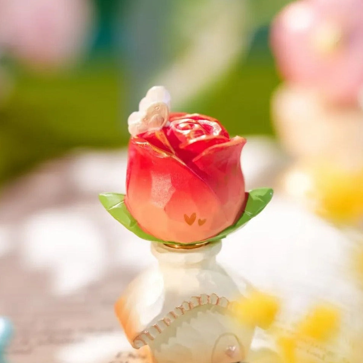 Floral Whispers Series Spin Figure Blind Box - Rose-shaped spin figure detail with lower base partially obscured; random design not guaranteed