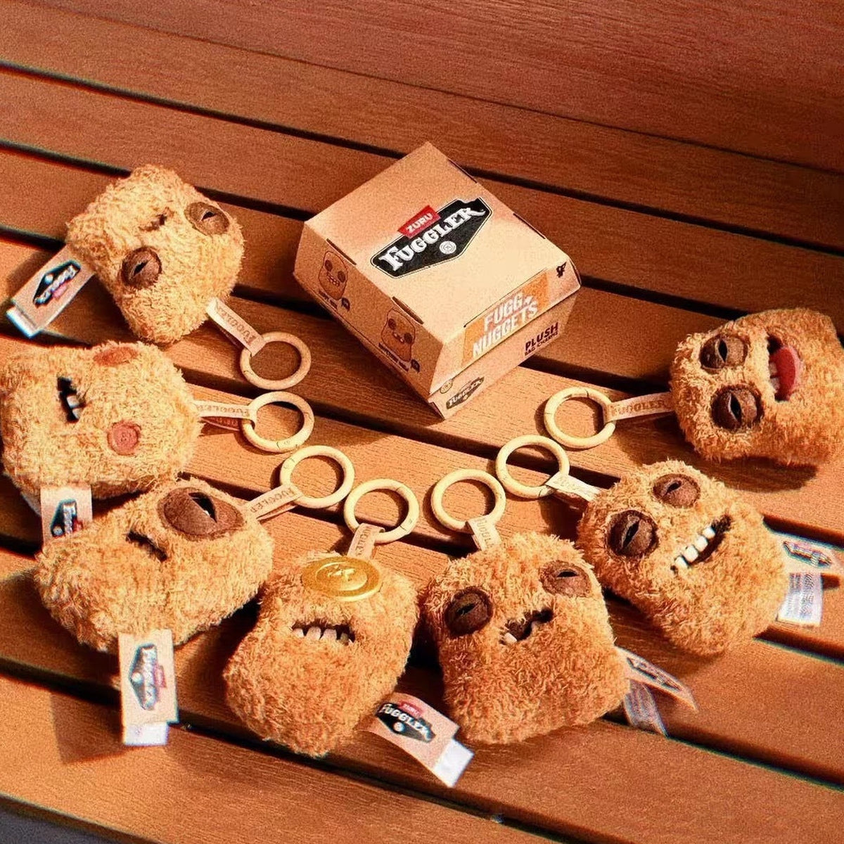 FUGGLER Fugg Nuggets Series Plush Pendant Blind Box - Series overview with complete central plush examples and keyring details; outer examples cropped; random design not guaranteed