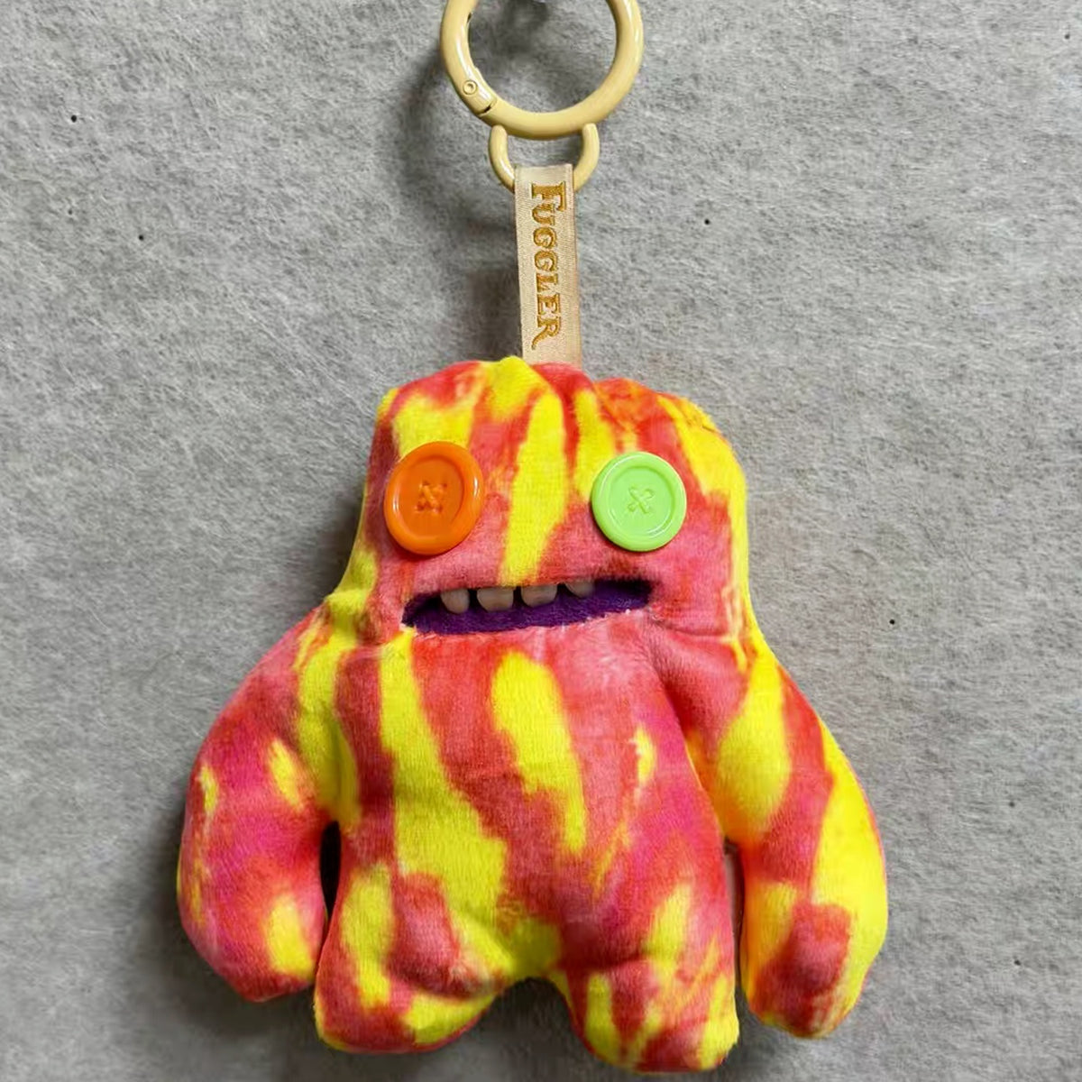 Fuggler Funny Ugly Monster Keypers V6 Series Plush Key Chain Dolls, Blind Box - Orange and yellow plush key chain design example; random design not guaranteed