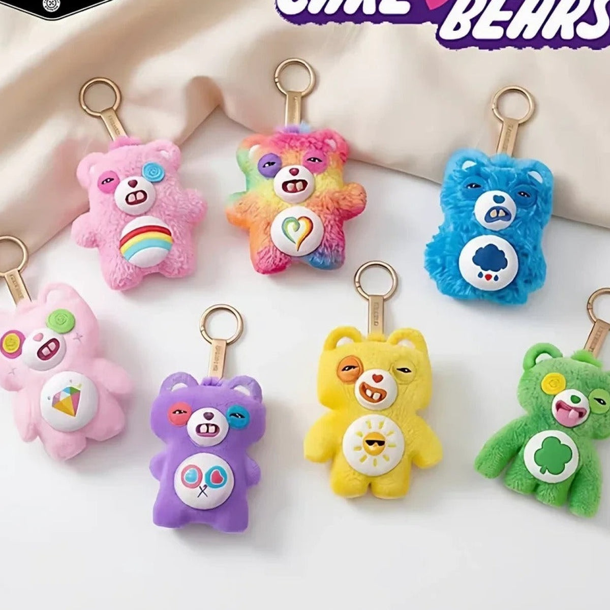 Fuggler x Care Bears Series Plush Pendant Blind Box - Care Bears collaboration group display with complete central plush pendant examples; random design not guaranteed