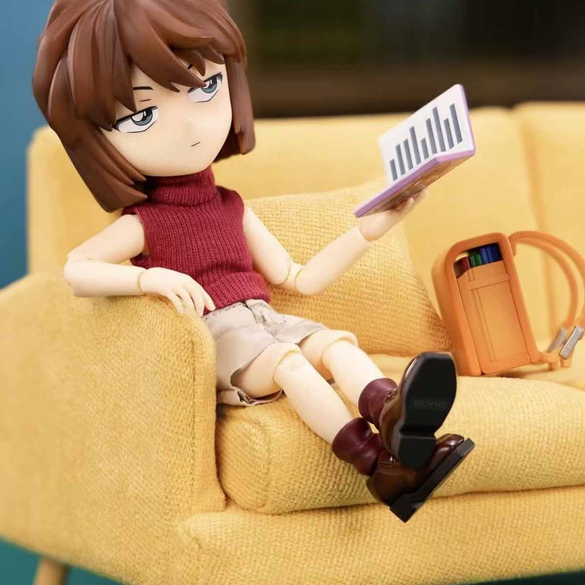 Haibara Ai action figure — seated pose in a styled scene