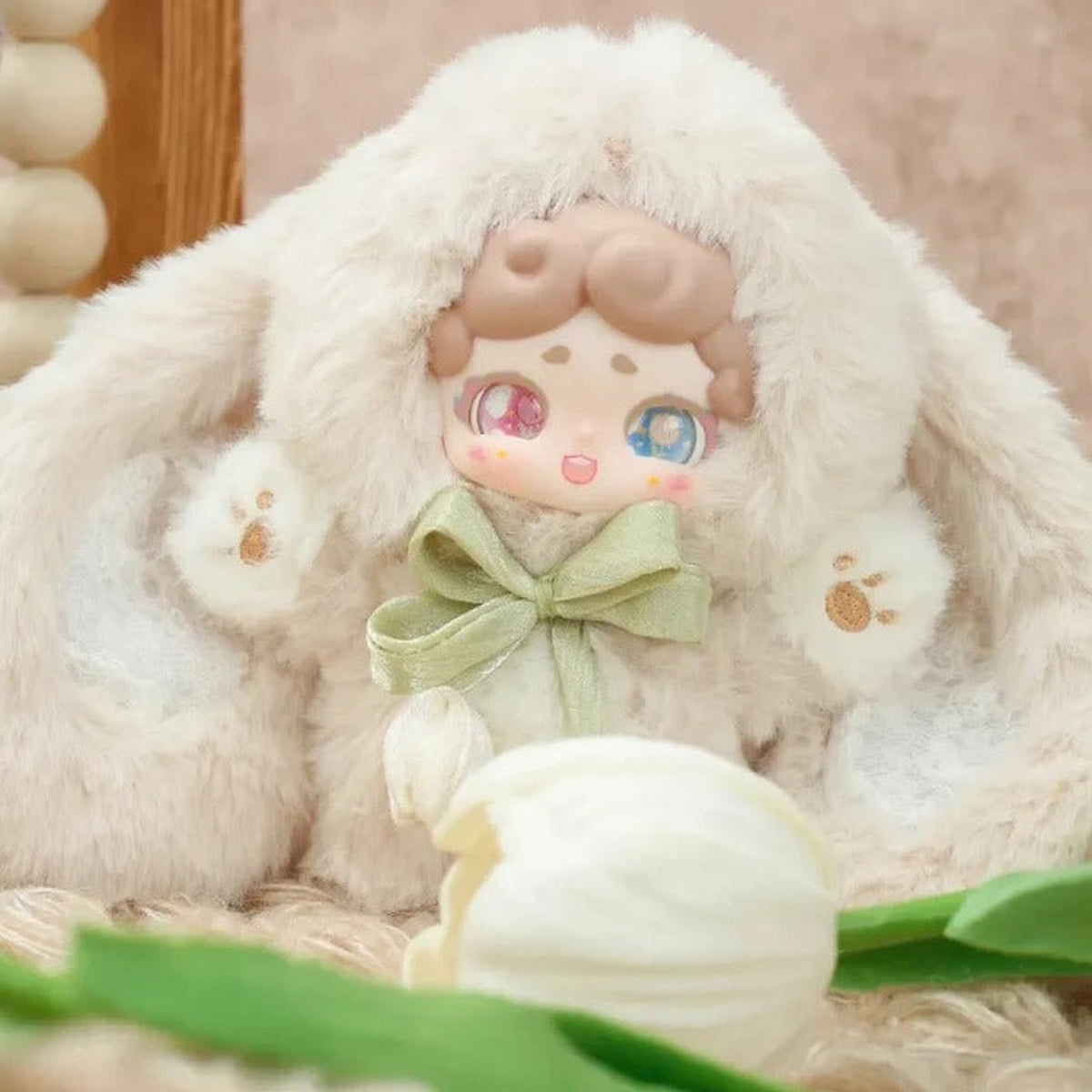 Good Night Bunny V2 Secret Garden Series Plush Blind Box - Cream rabbit-costume plush design with brown hair and green bow; outer ears cropped and lower feet obscured by flower prop; random design not guaranteed; display props not included