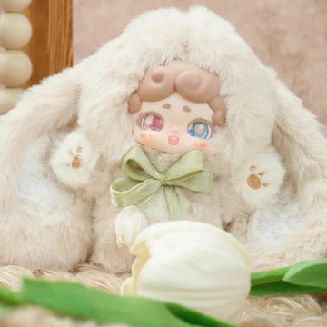 Good Night Bunny V2 Secret Garden Series Plush Blind Box - Cream rabbit-costume plush design with brown hair and green bow; outer ears cropped and lower feet obscured by flower prop; random design not guaranteed; display props not included