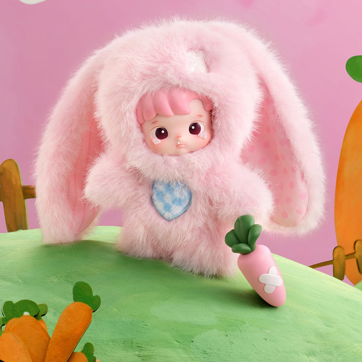 HACIPUPU Enchanted Realm Tales blind box series - design example in a pink rabbit costume holding a carrot
